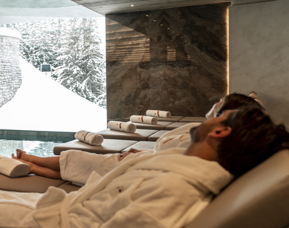 Guests relaxing poolside at Pure Wellness