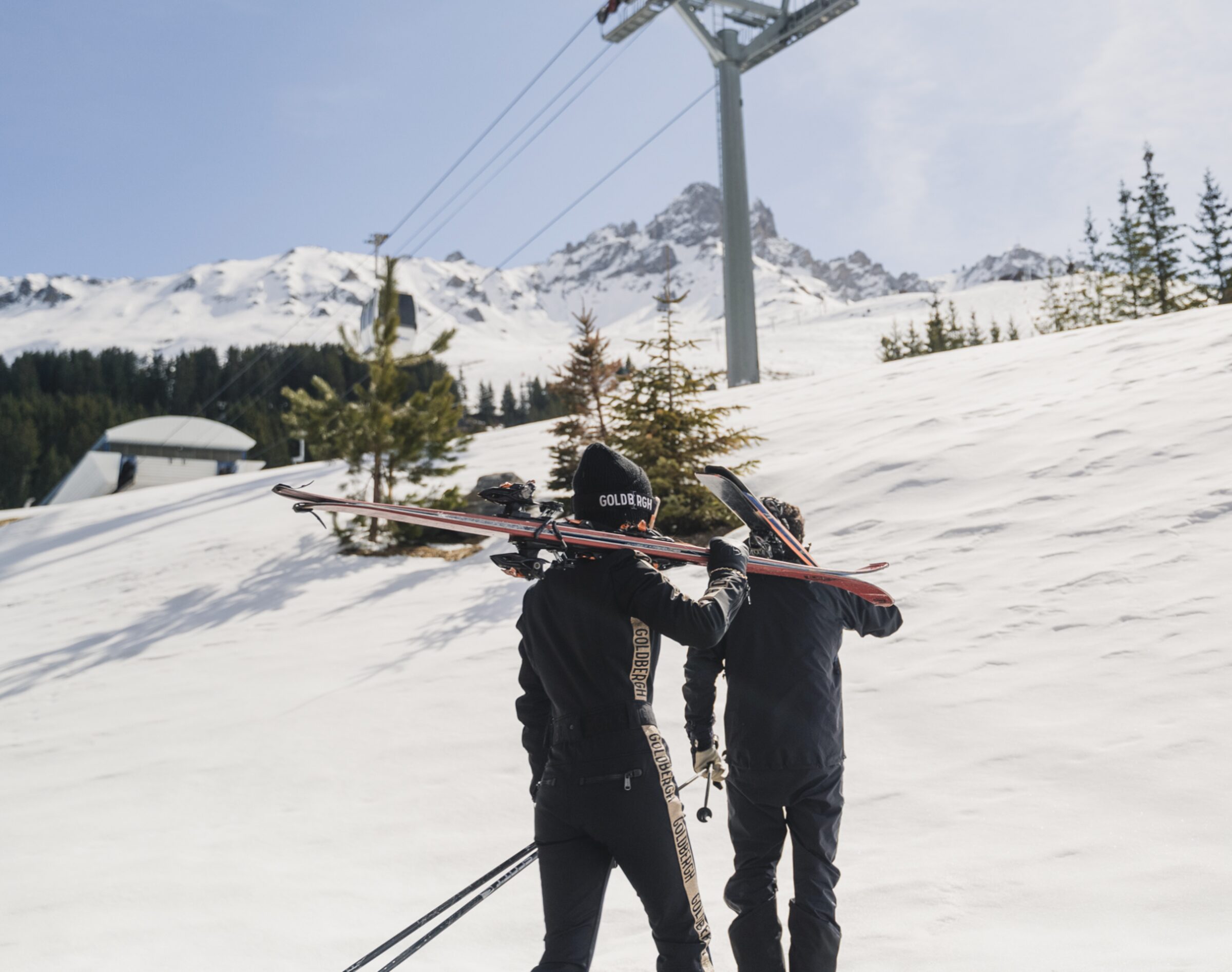 Skiers walking up the mountain, Courchevel